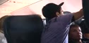 Freddie talking with his hands on the plane