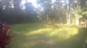 A group rolls through a grassy opening on a fire road section.