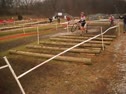 Elite Women in logs and serpentine at Jingle Cross