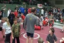 Coach Krause on the mic checking on headlock defense.