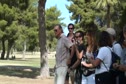 Coach Mark Wetmore being beckoned for a group photo at Pac-12 XC Champs 2011