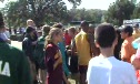 HS kids around Hassan after his race