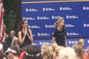 Mary Wittenberg on stage with Kara Goucher before NYRR mini